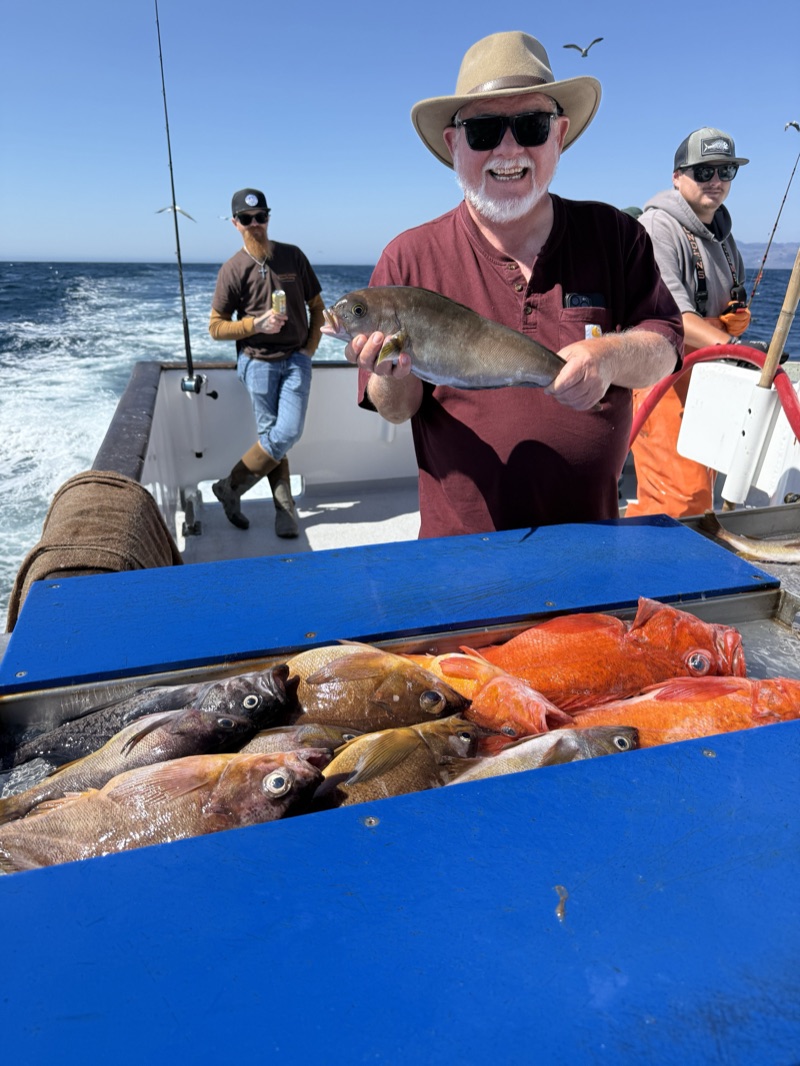 Angler with a colorful catch of rockfish on a deep sea fishing trip